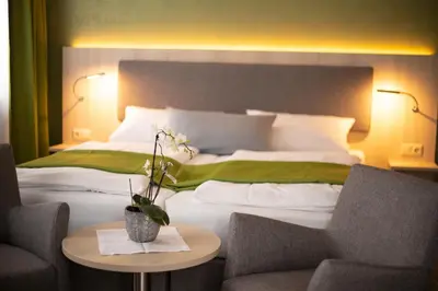Ein Bett oder Betten in einem Zimmer der Unterkunft Verwöhn-Pension Wiesengrund