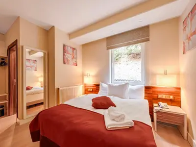 Ein Bett oder Betten in einem Zimmer der Unterkunft Sunday Schwarzbachtal Hideaway Resort