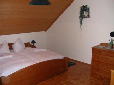 Ein Bett oder Betten in einem Zimmer der Unterkunft Gästehaus Fichtelgebirgsblick