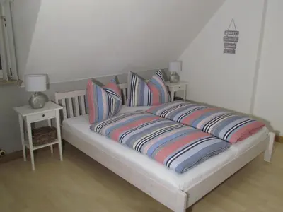 Ein Bett oder Betten in einem Zimmer der Unterkunft Ferienwohnung 