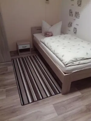Ein Bett oder Betten in einem Zimmer der Unterkunft Am Mühlteich