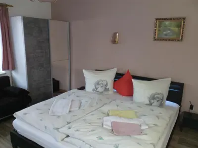Ein Bett oder Betten in einem Zimmer der Unterkunft Am Mühlteich