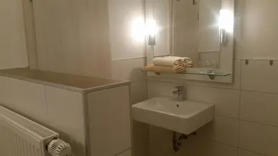 Ein Badezimmer in der Unterkunft Hotel-Pension Haus Hubertus