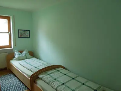 Ein Bett oder Betten in einem Zimmer der Unterkunft Ferienwohnung Scherr