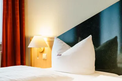 Ein Bett oder Betten in einem Zimmer der Unterkunft Waldhotel Vogtland