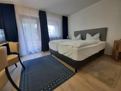 Ein Bett oder Betten in einem Zimmer der Unterkunft Hotel Pension Blüchersruh