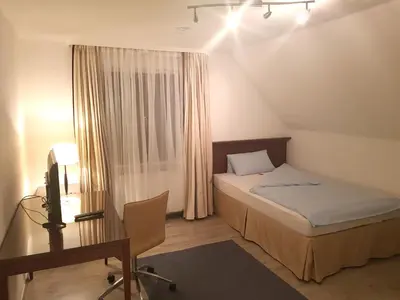 Ein Bett oder Betten in einem Zimmer der Unterkunft Hotel Pension Blüchersruh