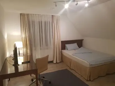 Ein Bett oder Betten in einem Zimmer der Unterkunft Hotel Pension Blüchersruh