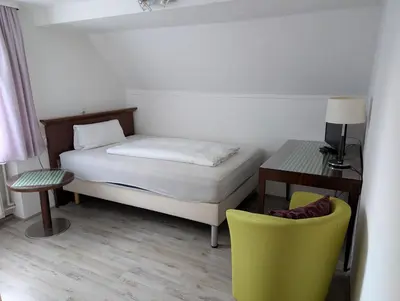 Ein Bett oder Betten in einem Zimmer der Unterkunft Hotel Pension Blüchersruh
