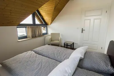 Ein Bett oder Betten in einem Zimmer der Unterkunft Ferienwohnung in Brand Finkenhöhe