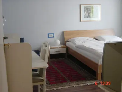 Ein Bett oder Betten in einem Zimmer der Unterkunft Hotel Schmidt