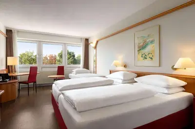 Ein Bett oder Betten in einem Zimmer der Unterkunft Amedia Weiden, Trademark Collection by Wyndham