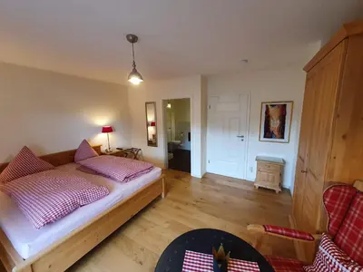 Ein Bett oder Betten in einem Zimmer der Unterkunft Pension am Kirschgarten