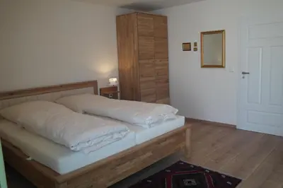 Ein Bett oder Betten in einem Zimmer der Unterkunft Pension am Kirschgarten