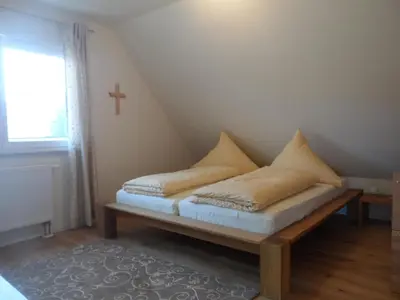 Ein Bett oder Betten in einem Zimmer der Unterkunft Pension am Kirschgarten