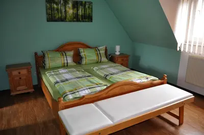 Ein Bett oder Betten in einem Zimmer der Unterkunft Ferienhaus Müller