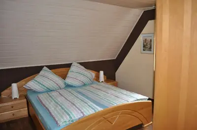 Ein Bett oder Betten in einem Zimmer der Unterkunft Ferienhaus Müller