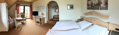 Ein Bett oder Betten in einem Zimmer der Unterkunft Hotel Bergblick
