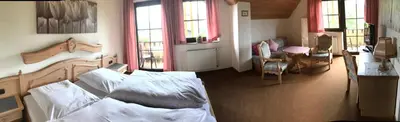 Ein Bett oder Betten in einem Zimmer der Unterkunft Hotel Bergblick