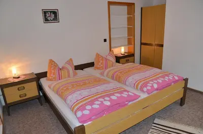 Ein Bett oder Betten in einem Zimmer der Unterkunft Pension Mausbachtal