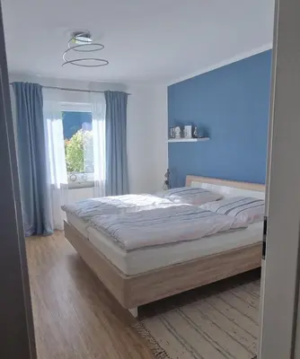 Ein Bett oder Betten in einem Zimmer der Unterkunft Ferienwohnung Sendelbeck