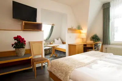 Ein Bett oder Betten in einem Zimmer der Unterkunft Hotel Heinz