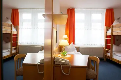 Ein Bett oder Betten in einem Zimmer der Unterkunft Hotel Heinz