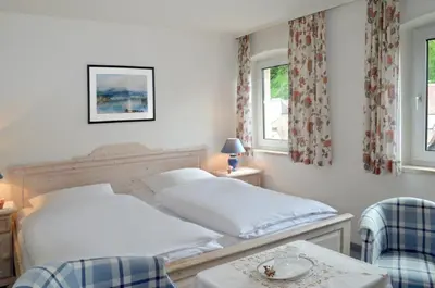 Ein Bett oder Betten in einem Zimmer der Unterkunft Hotel Haus Bauer