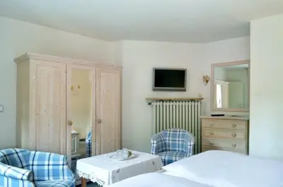 Ein Bett oder Betten in einem Zimmer der Unterkunft Hotel Haus Bauer