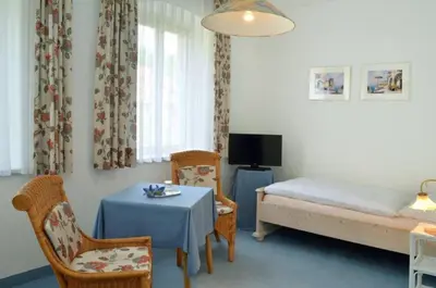 Ein Bett oder Betten in einem Zimmer der Unterkunft Hotel Haus Bauer