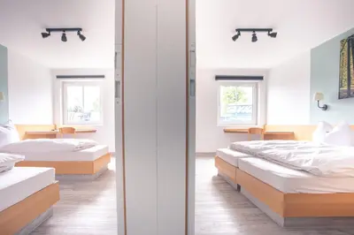 Ein Bett oder Betten in einem Zimmer der Unterkunft Auszeit Das Hotel Himmelkron