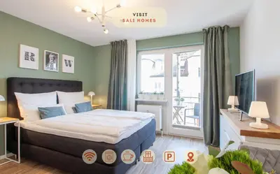 Ein Bett oder Betten in einem Zimmer der Unterkunft Sali Homes - Wahnfried No 1 City Apartment Balcony