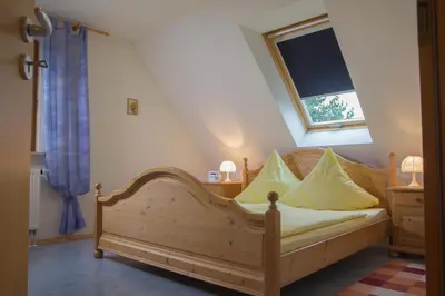 Ein Bett oder Betten in einem Zimmer der Unterkunft Ferienwohnung Am Sonnenhang