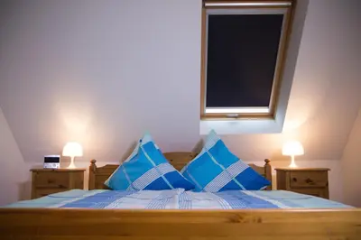 Ein Bett oder Betten in einem Zimmer der Unterkunft Ferienwohnung Am Sonnenhang
