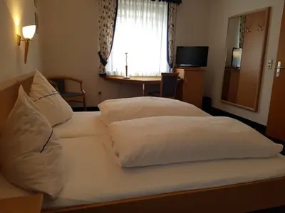 Ein Bett oder Betten in einem Zimmer der Unterkunft Gasthof Pension Walther