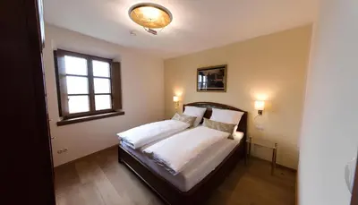 Ein Bett oder Betten in einem Zimmer der Unterkunft Ferienwohnung am Blasturm