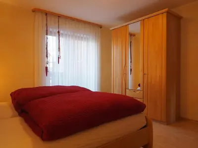 Ein Bett oder Betten in einem Zimmer der Unterkunft Ferienwohnung Herbst