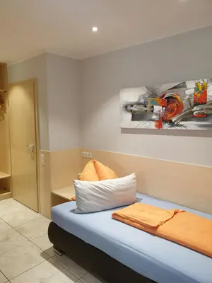 Ein Bett oder Betten in einem Zimmer der Unterkunft Hausner`s Hotel- Studio Apartments