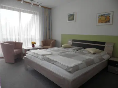 Ein Bett oder Betten in einem Zimmer der Unterkunft Gästehaus Sonneck