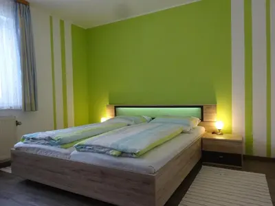 Ein Bett oder Betten in einem Zimmer der Unterkunft Gästehaus Sonneck