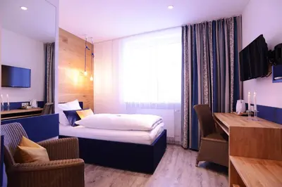 Ein Bett oder Betten in einem Zimmer der Unterkunft Gasthof zur Post Hotel und Parkplatz