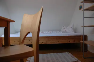 Ein Bett oder Betten in einem Zimmer der Unterkunft Ferienwohnung Langenstadt