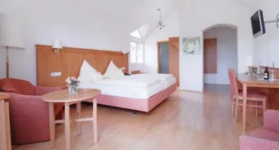 Ein Bett oder Betten in einem Zimmer der Unterkunft Hotel Wiesend