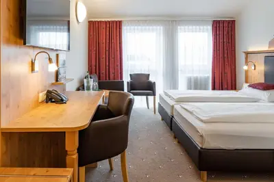 Ein Bett oder Betten in einem Zimmer der Unterkunft Hotel Wolfringmühle