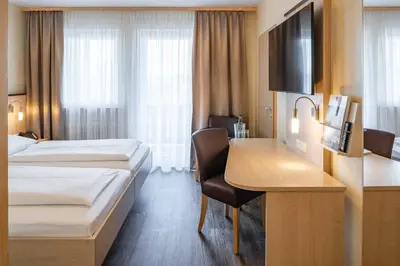 Ein Bett oder Betten in einem Zimmer der Unterkunft Hotel Wolfringmühle