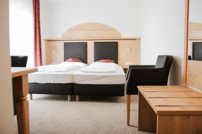 Ein Bett oder Betten in einem Zimmer der Unterkunft Hotel Wolfringmühle