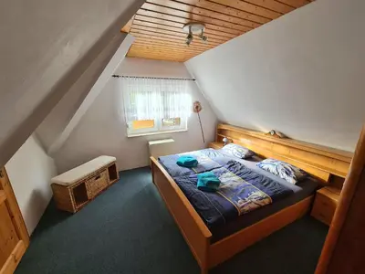 Ein Bett oder Betten in einem Zimmer der Unterkunft Ferienhaus Am Becherberg