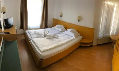 Ein Bett oder Betten in einem Zimmer der Unterkunft Pension Nadia