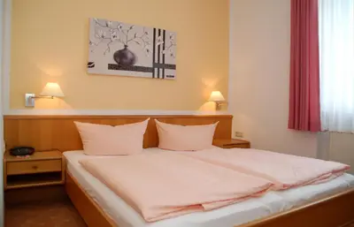 Ein Bett oder Betten in einem Zimmer der Unterkunft Hotel Goldner Anker