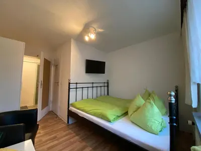 Ein Bett oder Betten in einem Zimmer der Unterkunft Pension Glückauf